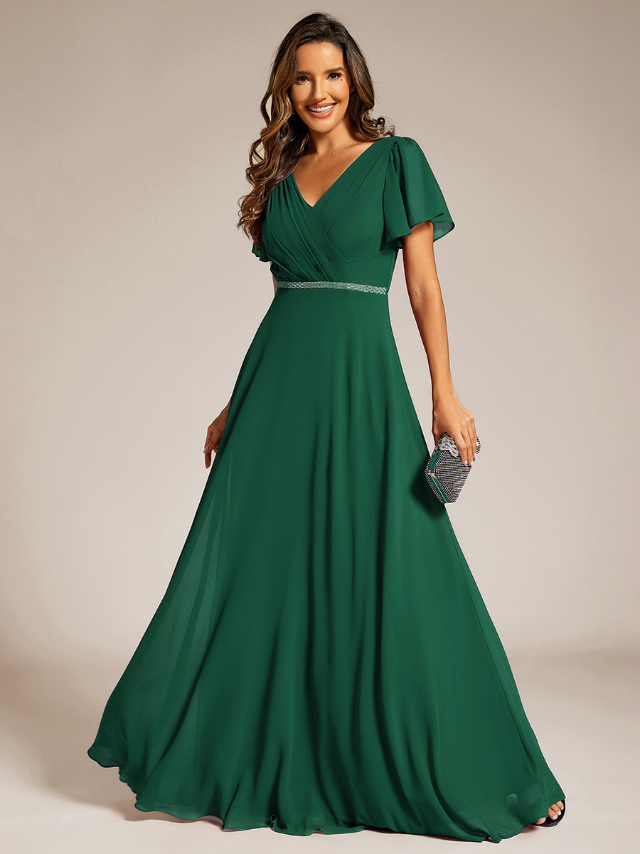 Robe de soirée plissée trapèze en mousseline de soie manches courtes et taille à sequins #Couleur_Vert Fonce